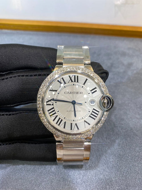 Silver wristwatch with diamond bezel, Roman numeral dial and metal link bracelet