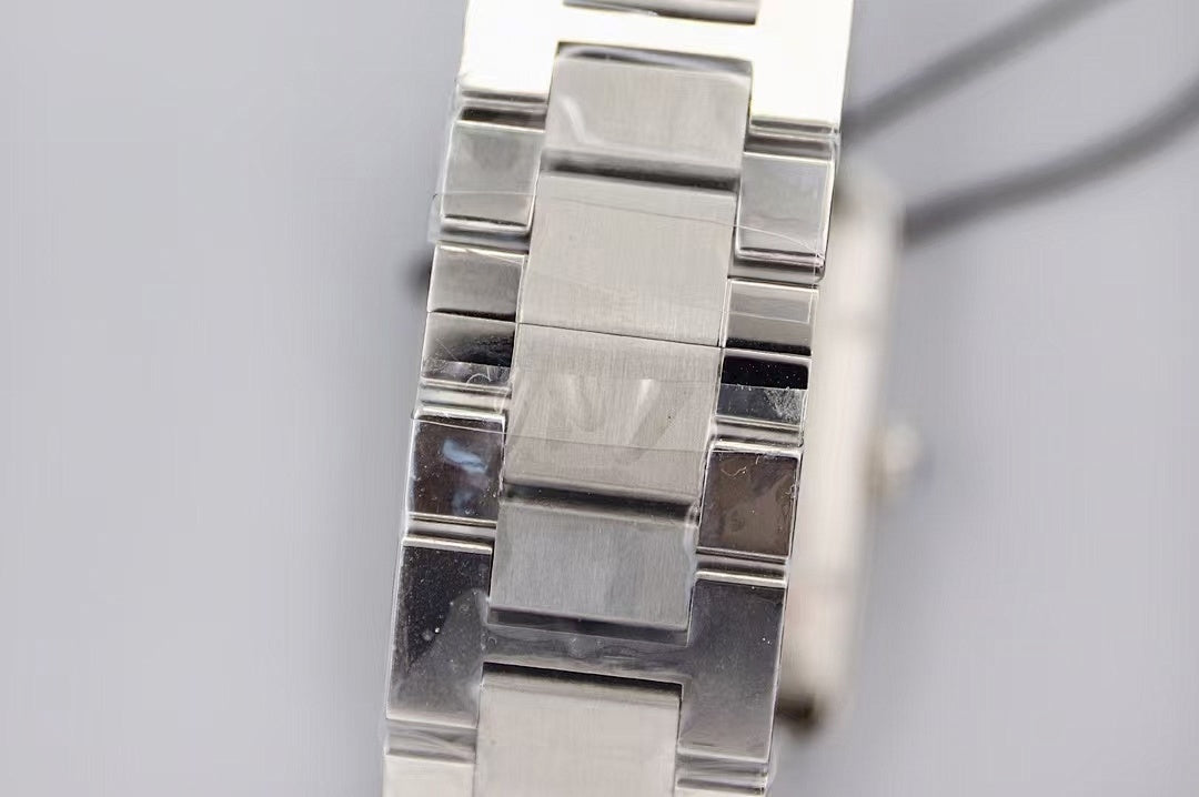 Cartier wristwatch bracelet close-up, polished and brushed silver links