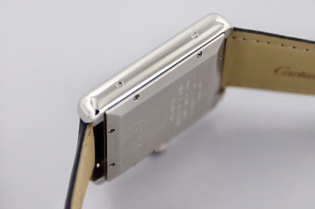 Rectangular stainless watch case side with crown and black leather strap
