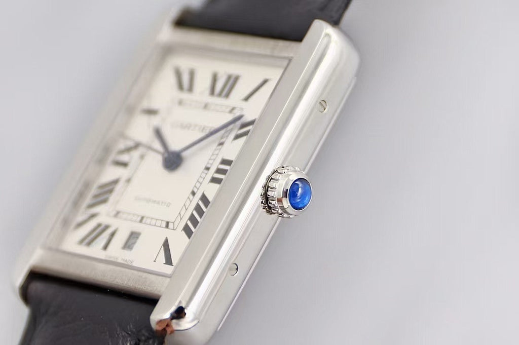Rectangular silver watch with white dial, Roman numerals, black leather strap