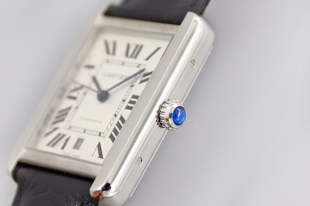 Rectangular silver watch with white dial, Roman numerals, black leather strap