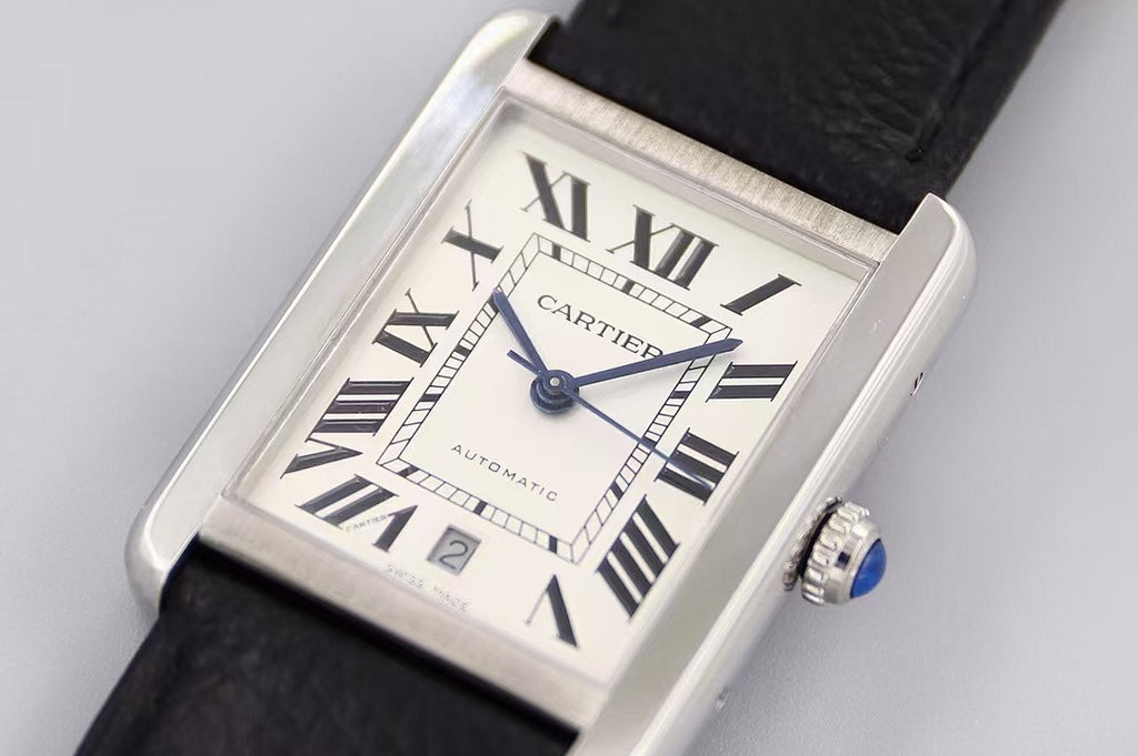 Rectangular watch with white dial, Roman numerals and blue hands, black leather strap