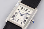 Rectangular watch with white dial, Roman numerals and blue hands, black leather strap