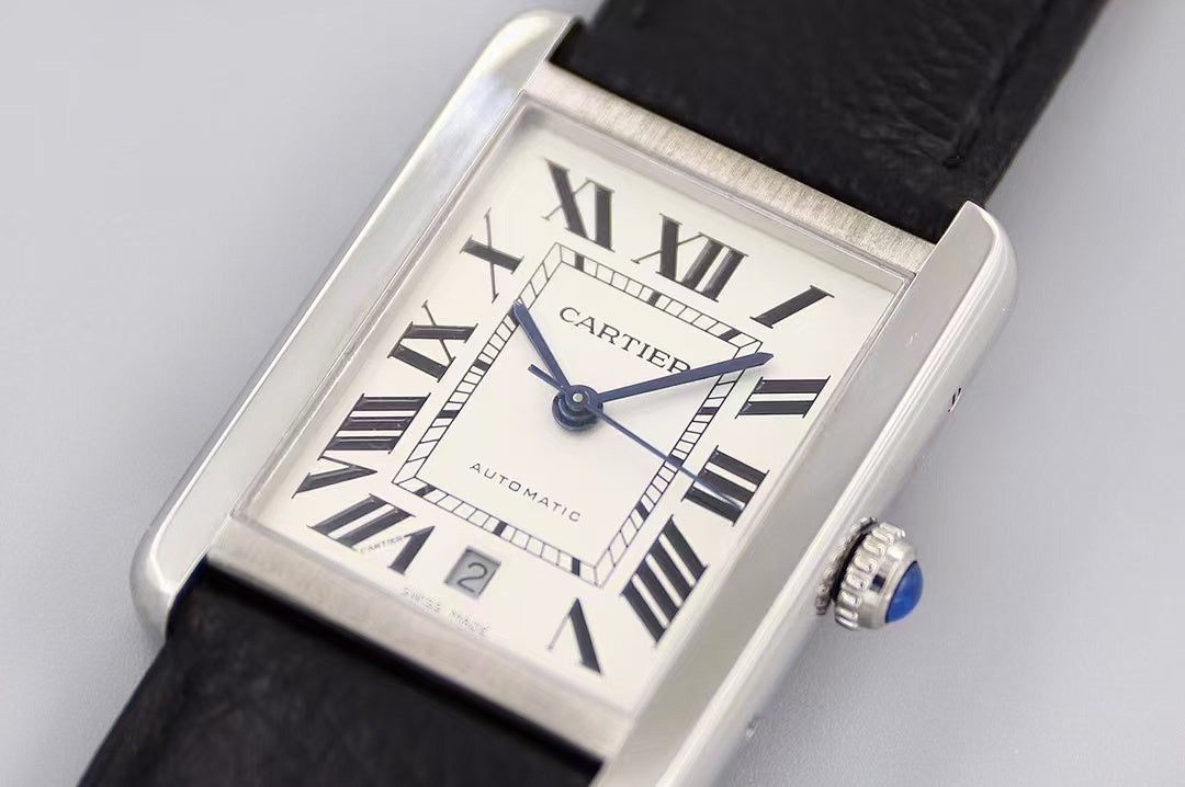 Rectangular watch with white dial, Roman numerals and blue hands, black leather strap