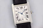 Rectangular silver watch with white dial, Roman numerals, blue minute hand, leather strap