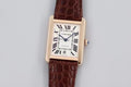 Rectangular Cartier wristwatch with white dial and dark brown leather strap
