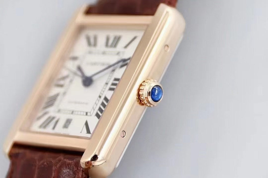 Cartier rectangular wristwatch with white dial, Roman numerals, and brown leather strap