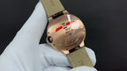 Cartier watch side view, gold-tone case and leather strap on display