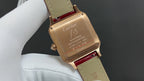 Cartier watch case with engraved back, red leather strap, gold-toned finish