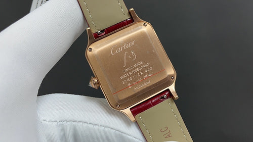 Cartier watch case with engraved back, red leather strap, gold-toned finish