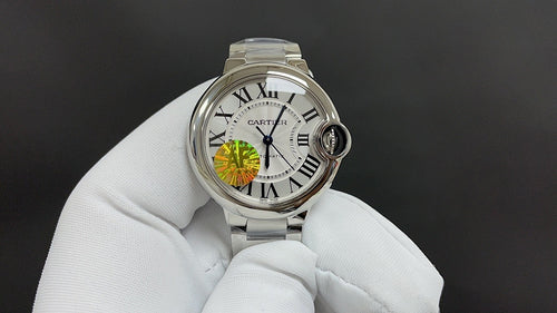 Cartier stainless steel wristwatch with white dial, Roman numerals and subdials