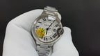 Cartier stainless steel wristwatch with white dial and Roman numerals