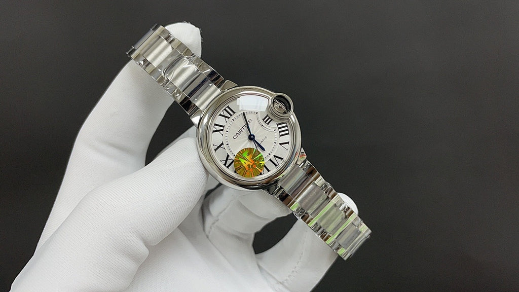 Stainless steel wristwatch with white dial and bracelet detail, angled profile