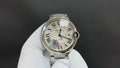 Cartier wristwatch with silver metal bracelet, white Roman numeral dial, crown at 3