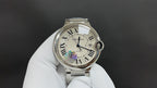 Cartier wristwatch with silver metal bracelet, white Roman numeral dial, crown at 3