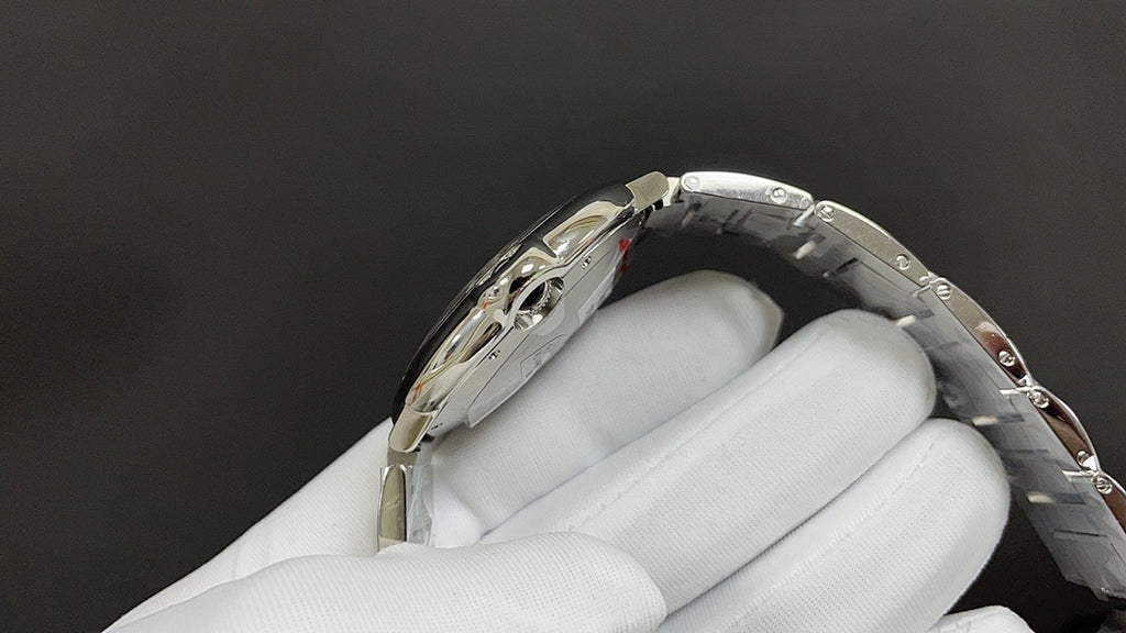 Wristwatch case back and bracelet angled view, metal links with engraved details