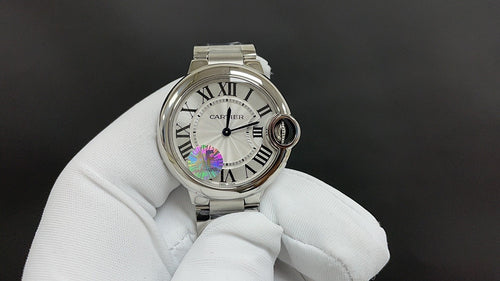Cartier wristwatch with silver-tone case, Roman numeral dial, and round crown