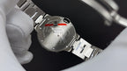Cartier wristwatch caseback with stainless-steel bracelet and engraved back text