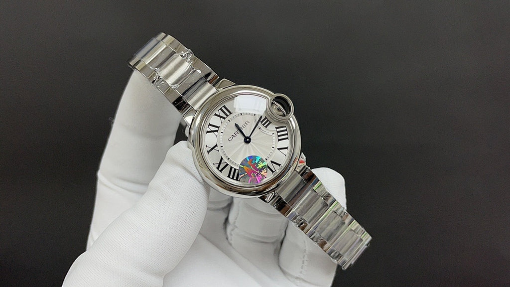 Cartier wristwatch angled view with metal bracelet and round bezel detail