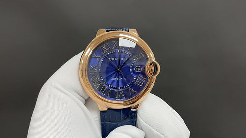 Cartier wristwatch with blue dial and rose gold case, blue leather strap