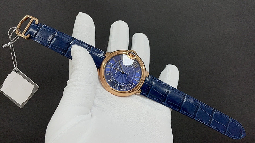Cartier wristwatch on blue leather strap with buckle, showing hanging tag(s)