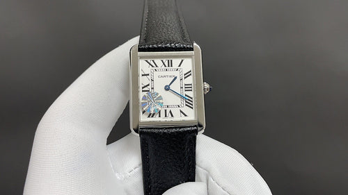 Cartier watch with black leather strap, rectangular silver case, Roman numeral dial