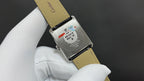 Cartier watch with beige leather strap, stainless case back with date-style sticker