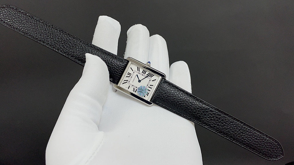 Cartier watch with black leather strap, square silver case, Roman numeral dial