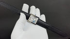 Cartier watch with black leather strap, square silver case, Roman numeral dial