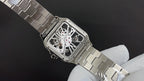 Cartier skeleton dial watch with steel link bracelet, angled view