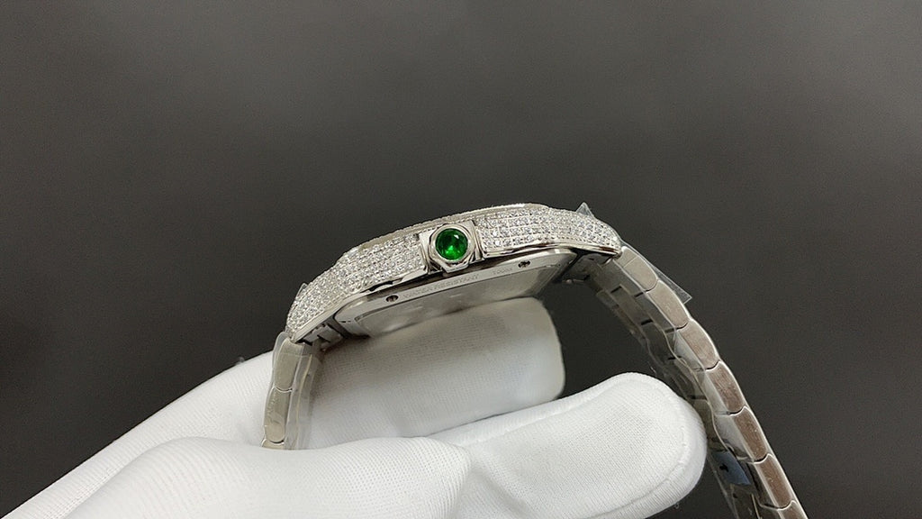 Cartier watch with green gemstone detail on diamond bezel and steel bracelet