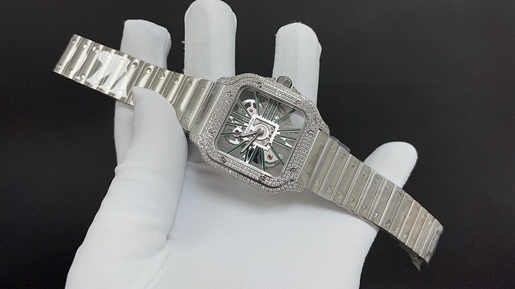 Cartier square watch with diamond bezel, green dial, and ribbed steel bracelet