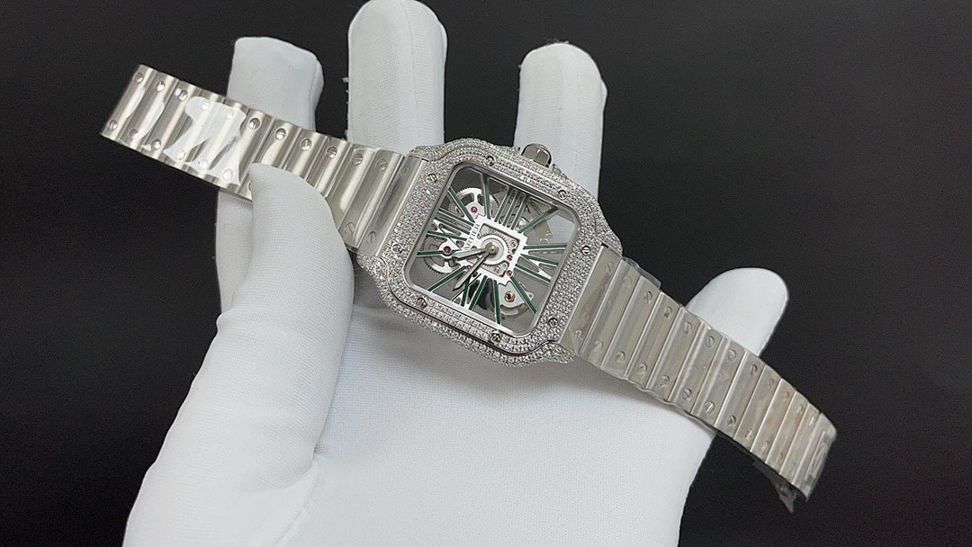 Cartier square watch with diamond bezel, green dial, and ribbed steel bracelet