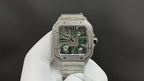 Cartier square diamond watch with green skeleton dial and steel bracelet, front view