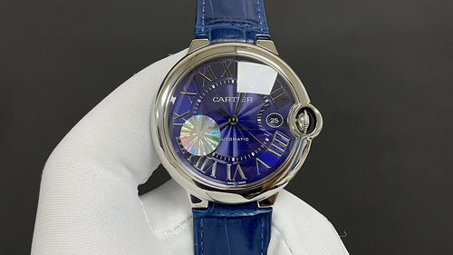 Round wristwatch with blue dial, Roman numerals, and blue leather strap