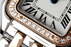 Close-up of Cartier watch bezel with diamond row and Roman numerals dial
