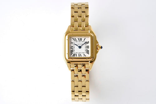Gold-tone Cartier Tank watch with rectangular case and metal link bracelet