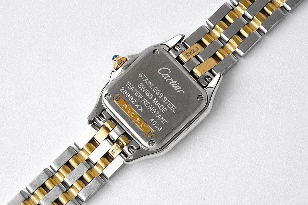 Cartier watch caseback with stainless steel text and gold detail on bracelet