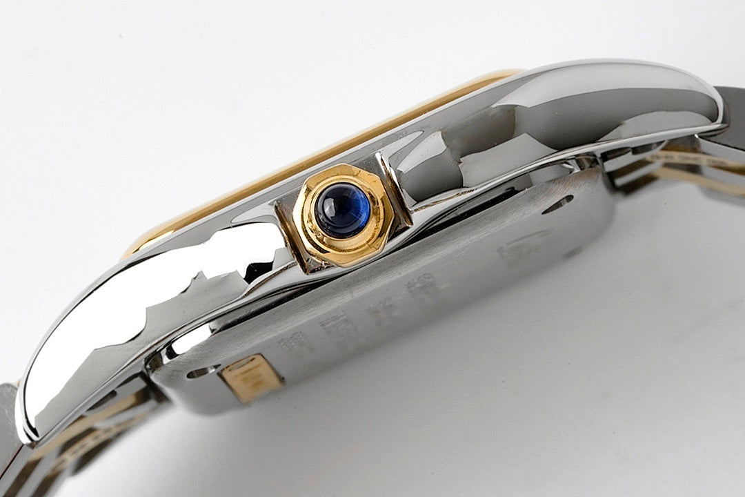 Cartier watch crown side with blue gemstone set in gold and stainless steel