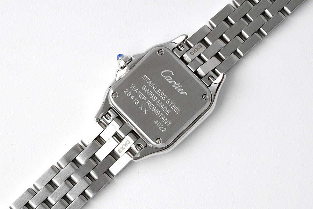 Cartier watch caseback in stainless steel with engraved text