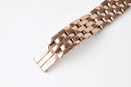 Rose gold watch bracelet end with clasp and polished link details