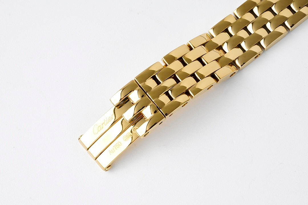 Gold-tone watch bracelet end with clasp and bar hardware on linked links