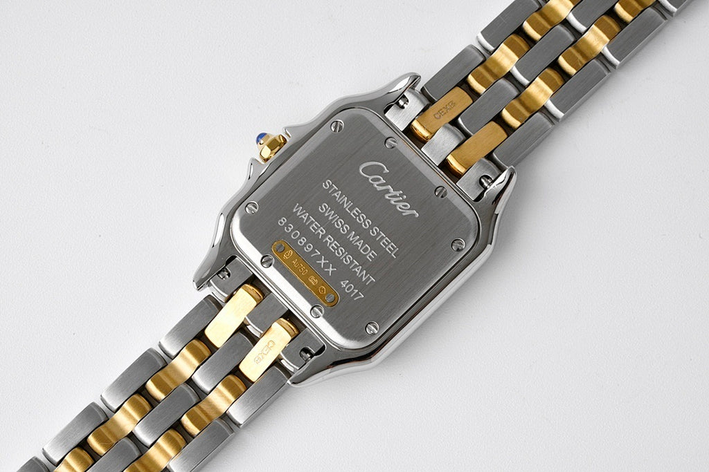 Cartier watch case back with text including "Stainless steel" and water resistant