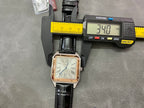 Cartier wristwatch on black leather strap, square case with Roman numeral dial