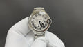 Cartier watch, silver metal bracelet, white dial with Roman numerals and blue hands
