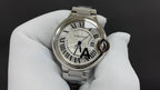 Cartier watch, silver case and bracelet, white dial with Roman numerals and dark hands