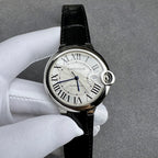 Cartier watch angled view: black leather strap, silver case, Roman numeral white dial.