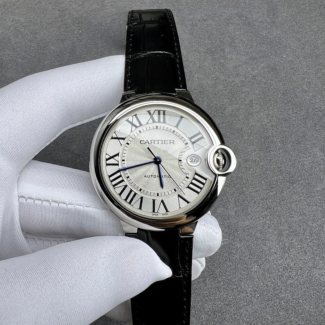 Cartier watch angled view: black leather strap, silver case, Roman numeral white dial.