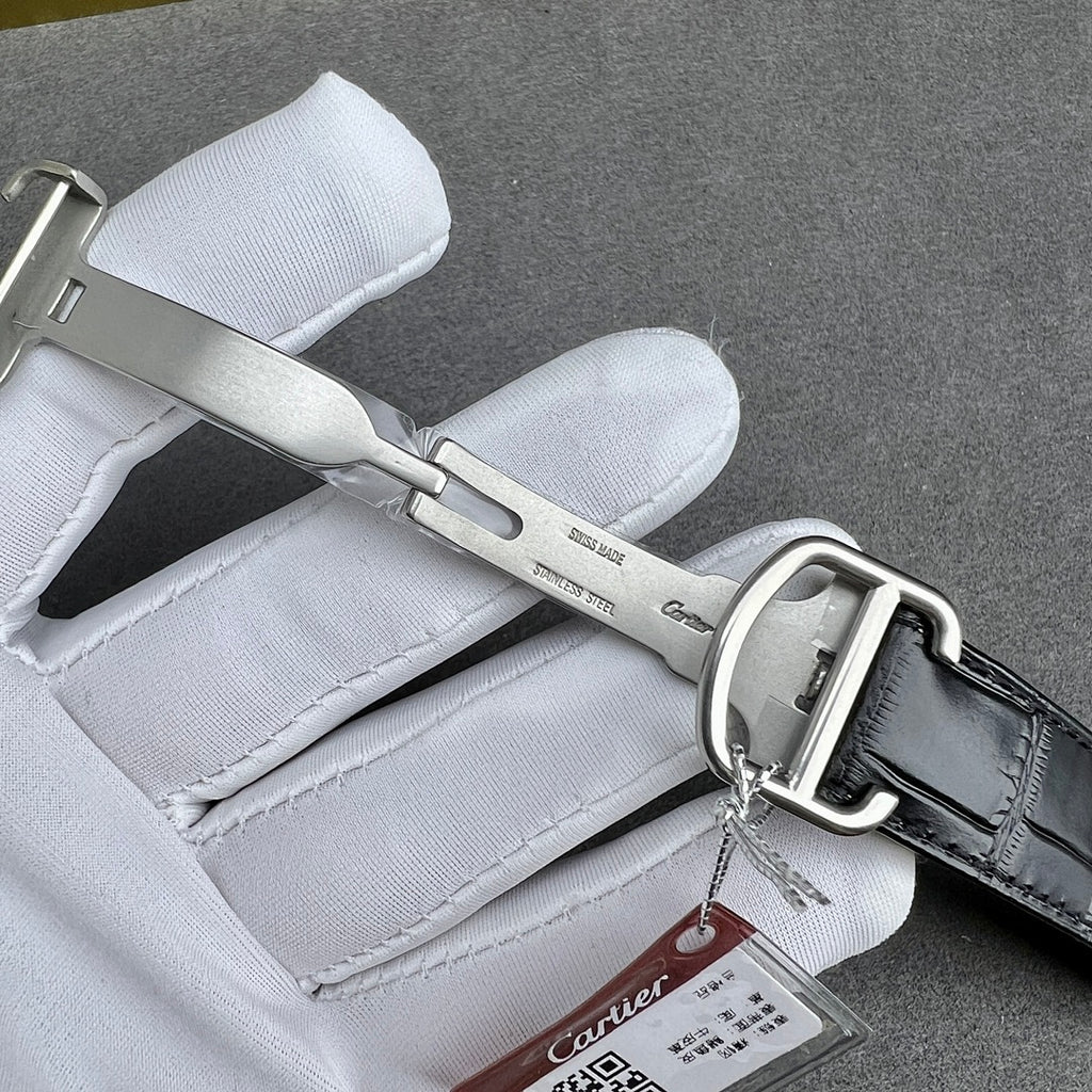 Cartier watch buckle and black leather strap, silver clasp with metal keeper.