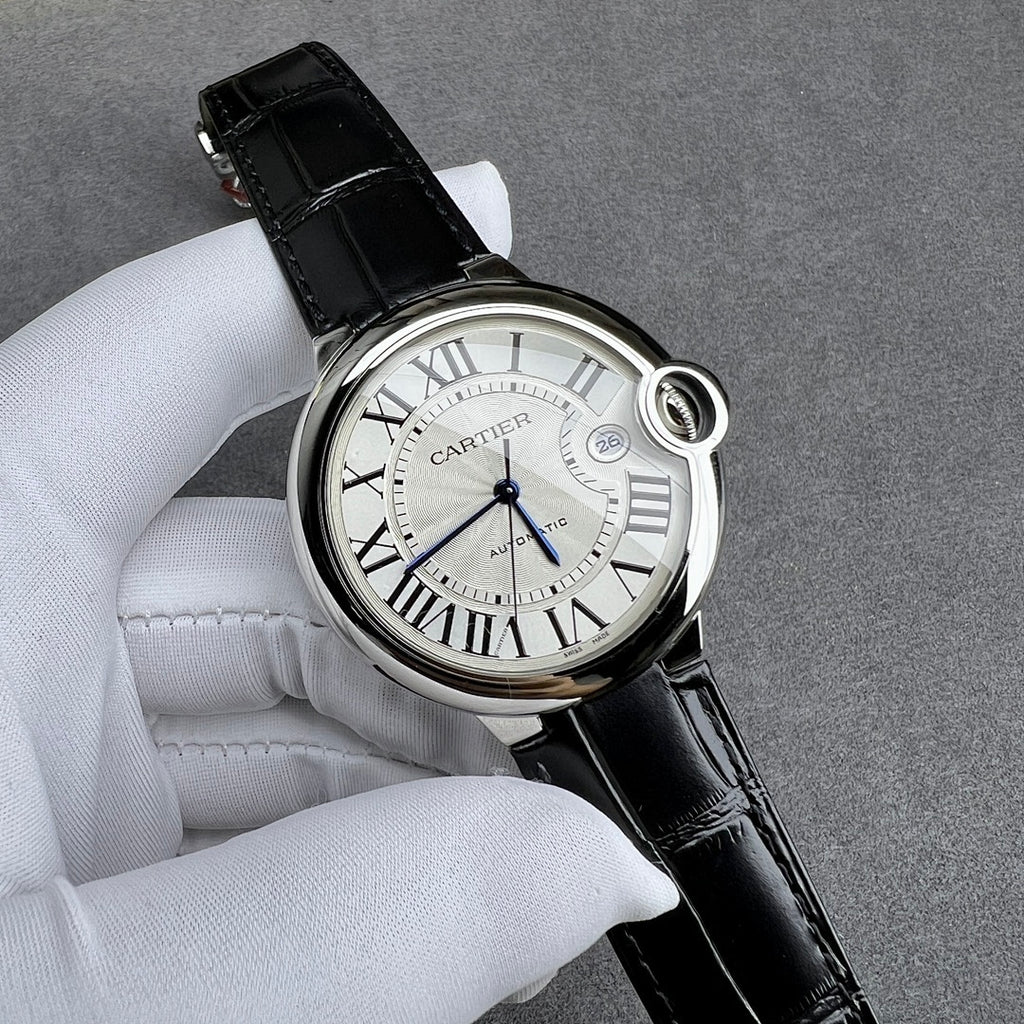 Cartier watch three-quarter view: black leather strap, silver case, Roman numeral white dial.